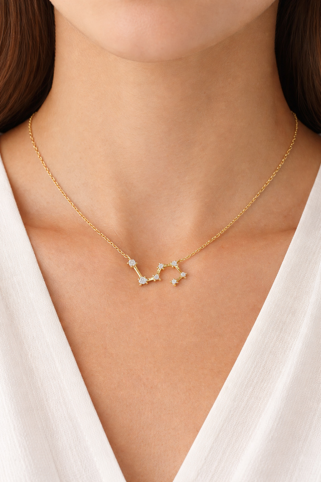 Delicate gold constellation necklace close-up